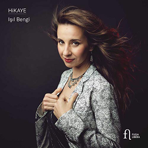 CD cover featuring a woman with flowing hair against a dark background.