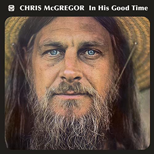 Close-up portrait of Chris McGregor with a long beard and straw hat.