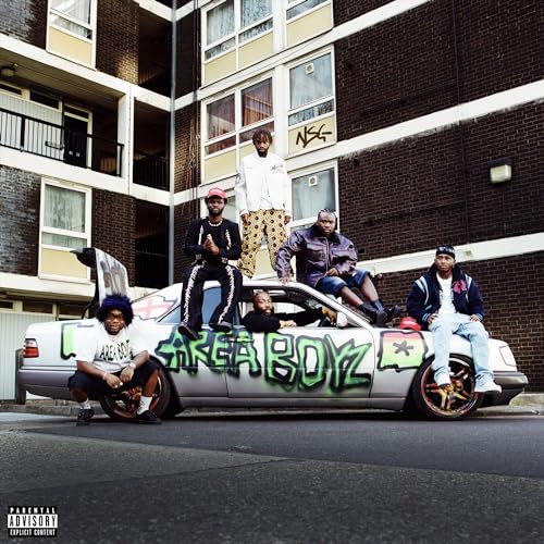 Four men with a car painted with "AREA BOYZ" in front of a building.