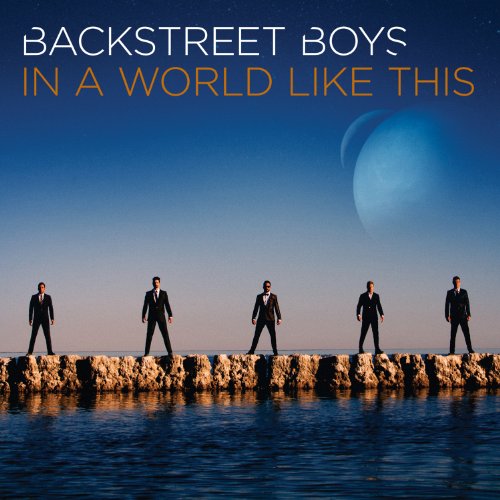 "CD cover with five men in black suits walking on a sandy terrain."