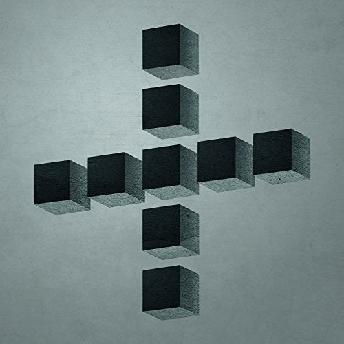 The image depicts a CD album cover featuring nine 3D cubes arranged in a cross-like pattern on a gray background.