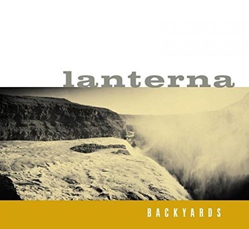 The alt text for the image is: "CD cover with 'lanterna' and 'backyards' text, featuring a rocky cliffside landscape."