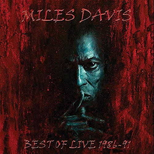 Album cover with a dark, red-toned image of Miles Davis' face.