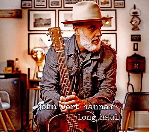 John Wort Hannam album cover featuring a bearded man with a guitar.
