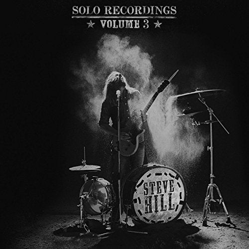 Black and white album cover featuring a musician with guitar and drum kit.