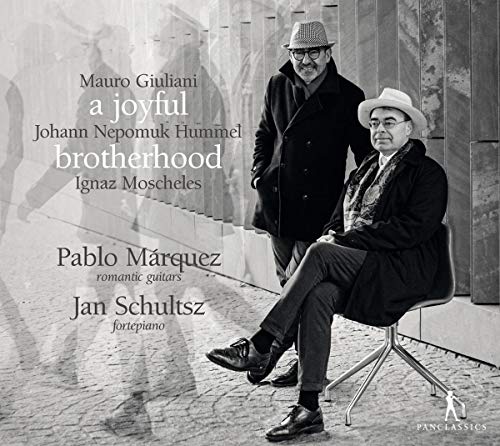 Black and white CD cover featuring two men in hats on a cobblestone street.
