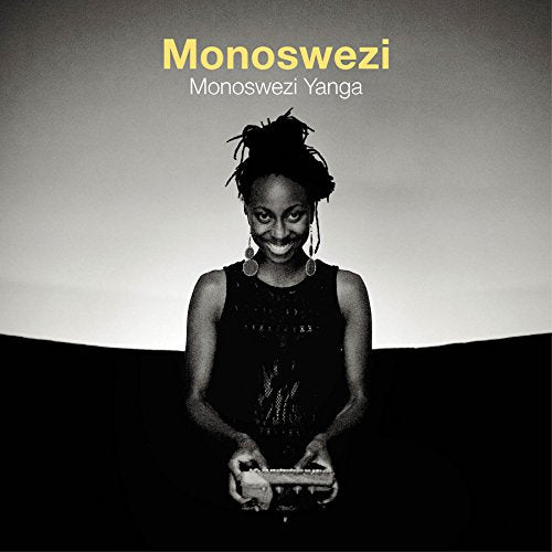 Black-and-white album cover with a woman holding a keyboard in front of her.