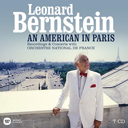 CD cover featuring Leonard Bernstein in white suit against Paris cityscape background.