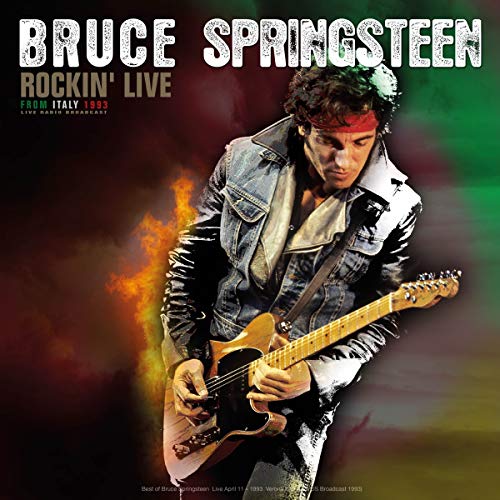 Bruce Springsteen wearing a headband and denim jacket playing guitar on stage.