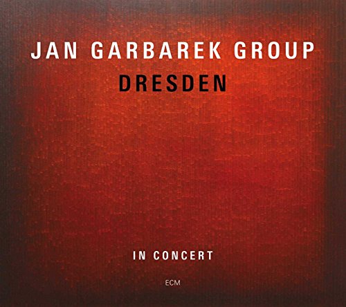 Album cover with red textured background and white and black text.