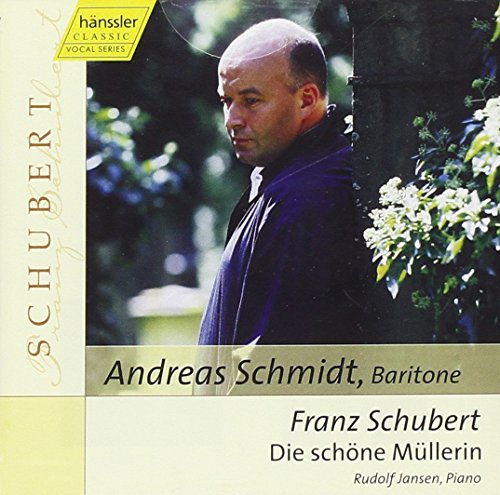 "CD cover with a man in a dark jacket, surrounded by greenery and flowers."