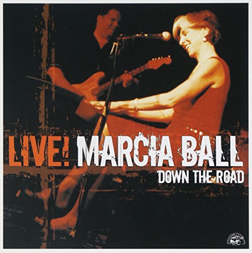 "CD cover with Marcia Ball singing into a microphone, a guitarist behind her."