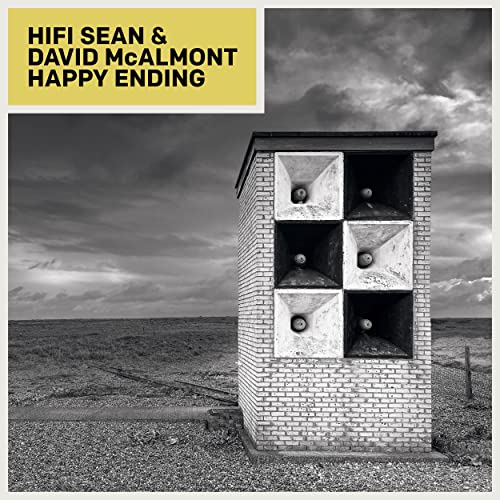 CD cover: brick speakers in a field under a cloudy sky.