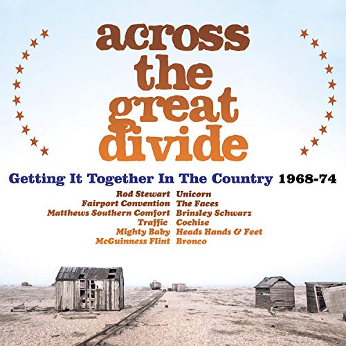 "Album cover with 'across the great divide' text and deserted landscape with old shacks."
