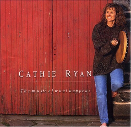 Cathie Ryan's album cover: woman holding a tambourine beside a red wooden wall.