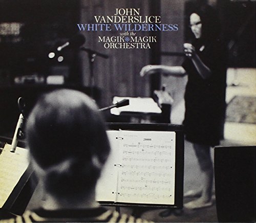 CD cover for John Vanderslice's "White Wilderness" showing musicians in a studio.