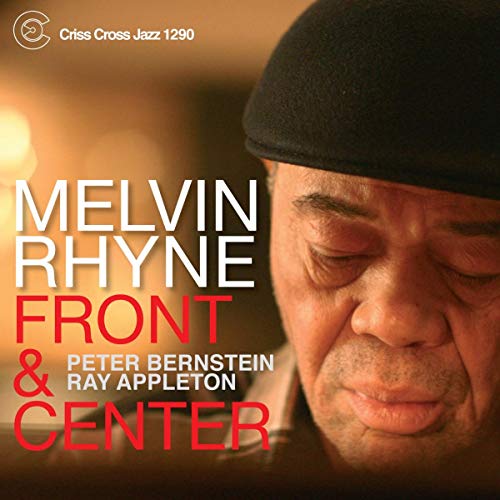 CD cover featuring portrait of Melvin Rhyne in a black cap, red text.