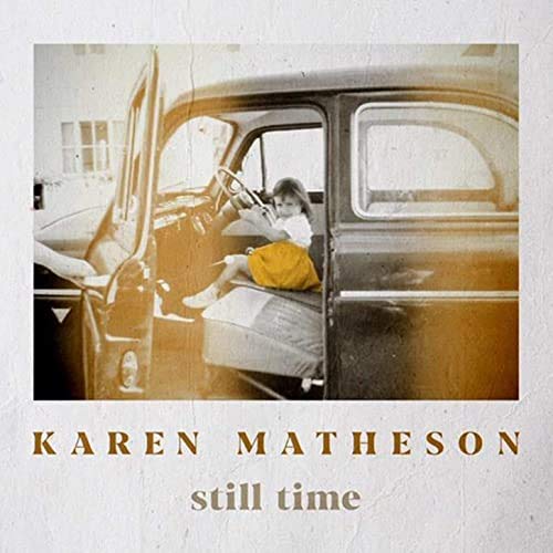CD cover: woman in a vintage car, sepia toned image.