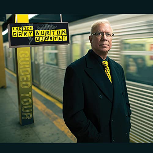 Gary Burton portrait with album art featuring a subway station scene.