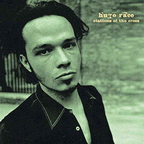 Black and white vinyl album cover featuring a man with dark hair and a black shirt.
