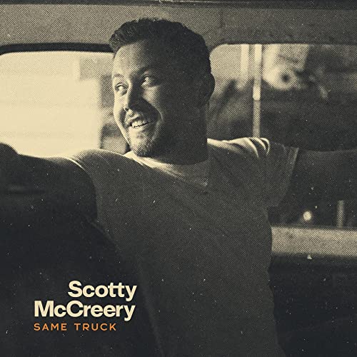 Scotty McCreery album cover, sepia-toned portrait of a man in a truck.