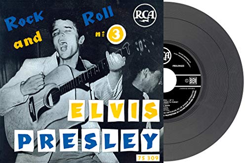 Elvis Presley album cover, 1956, featuring him playing guitar.