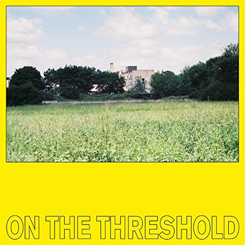 Record cover: field with buildings in distance, yellow background, text.