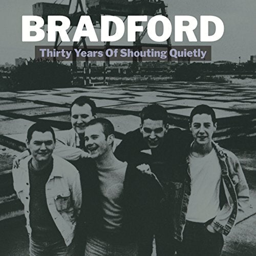 "CD cover featuring a black-and-white photo of five smiling men in casual clothing."