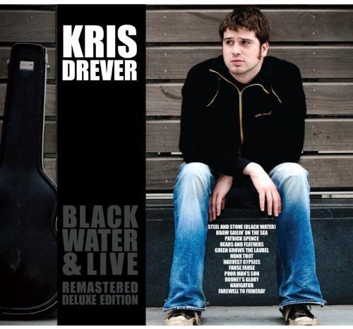"Kris Drever album cover with a man sitting on wooden steps beside a guitar case."