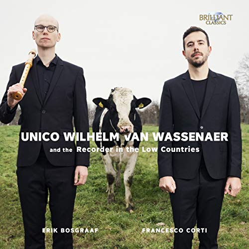 CD cover with two men in black suits and a cow in a field.