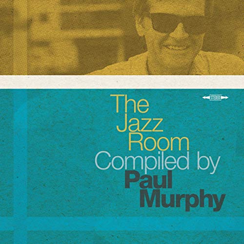 Vinyl album cover with a man's face and text on a blue background.