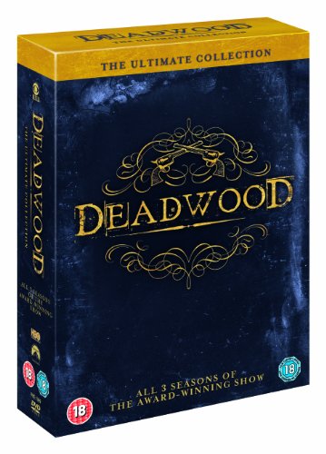 Deadwood" DVD box set, dark blue with gold lettering and a revolver design.