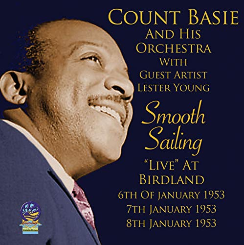 Album cover featuring a smiling man in a suit against a dark blue background.