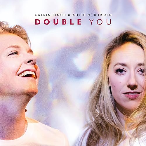 CD cover featuring portraits of two smiling women, Catrin Finch & Aoife Ní Bhriain.