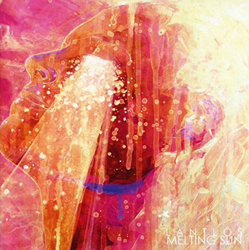 Abstract album cover featuring a face dissolving into warm, colorful light.