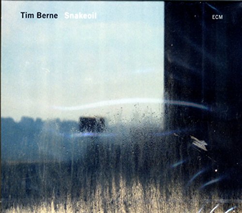 "Album cover for Tim Berne's 'Snakeoil' with a blurry, rainy window view."