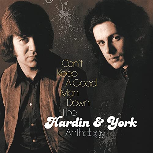 Album cover featuring two men with long hair and the title “Can’t Keep A Good Man Down.”