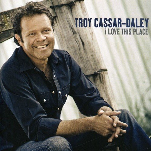 CD cover featuring Troy Cassar-Daley smiling, leaning against a wooden fence.