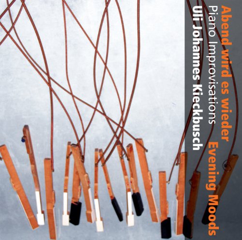 "CD cover with orange clothespins on strings against a grey background."