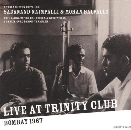 Black-and-white album cover with three men, one holding a tall musical instrument.