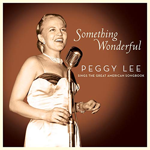 Peggy Lee singing into a vintage microphone on album cover.