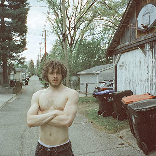 Jack Harlow album cover, shirtless man standing on a residential street.