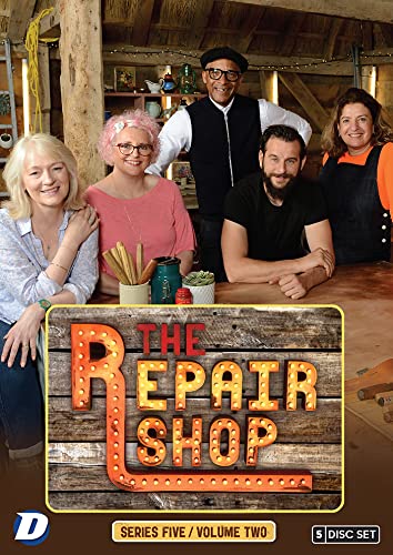 The cast of The Repair Shop posing together in a workshop on a DVD cover.