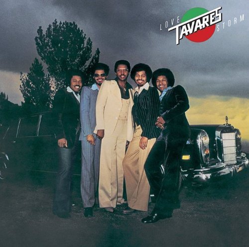 The five members of Tavares stand together in front of a limousine at dusk.