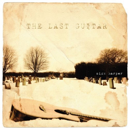 "Album cover with a snowy graveyard scene and a guitar, titled 'The Last Guitar'."