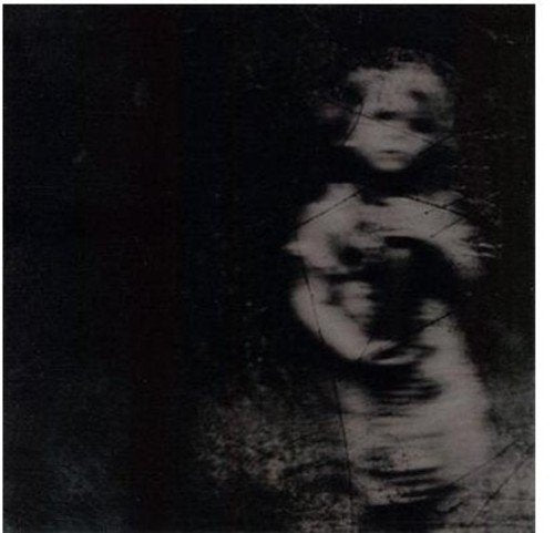 A blurry, black-and-white image of a person, likely a vinyl record cover.
