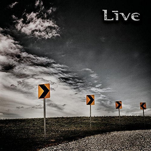 "Album cover with 'Live' text, gravel road, and directional signs under a cloudy sky."