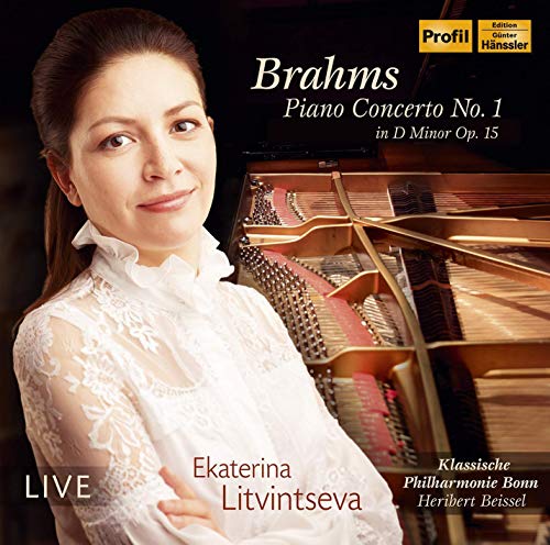 CD cover featuring a woman in white next to an open grand piano.