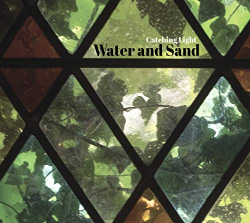 "Album cover with stained glass window image and text 'Water and Sand' and 'Catching Light'."