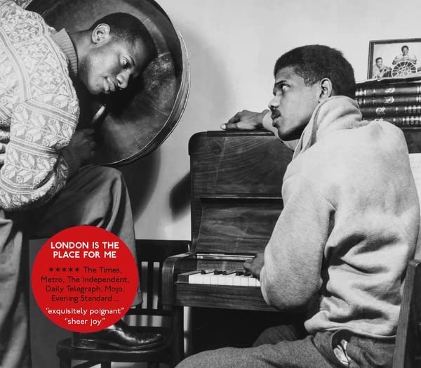 Black and white photo of two men with a piano, album title overlayed.